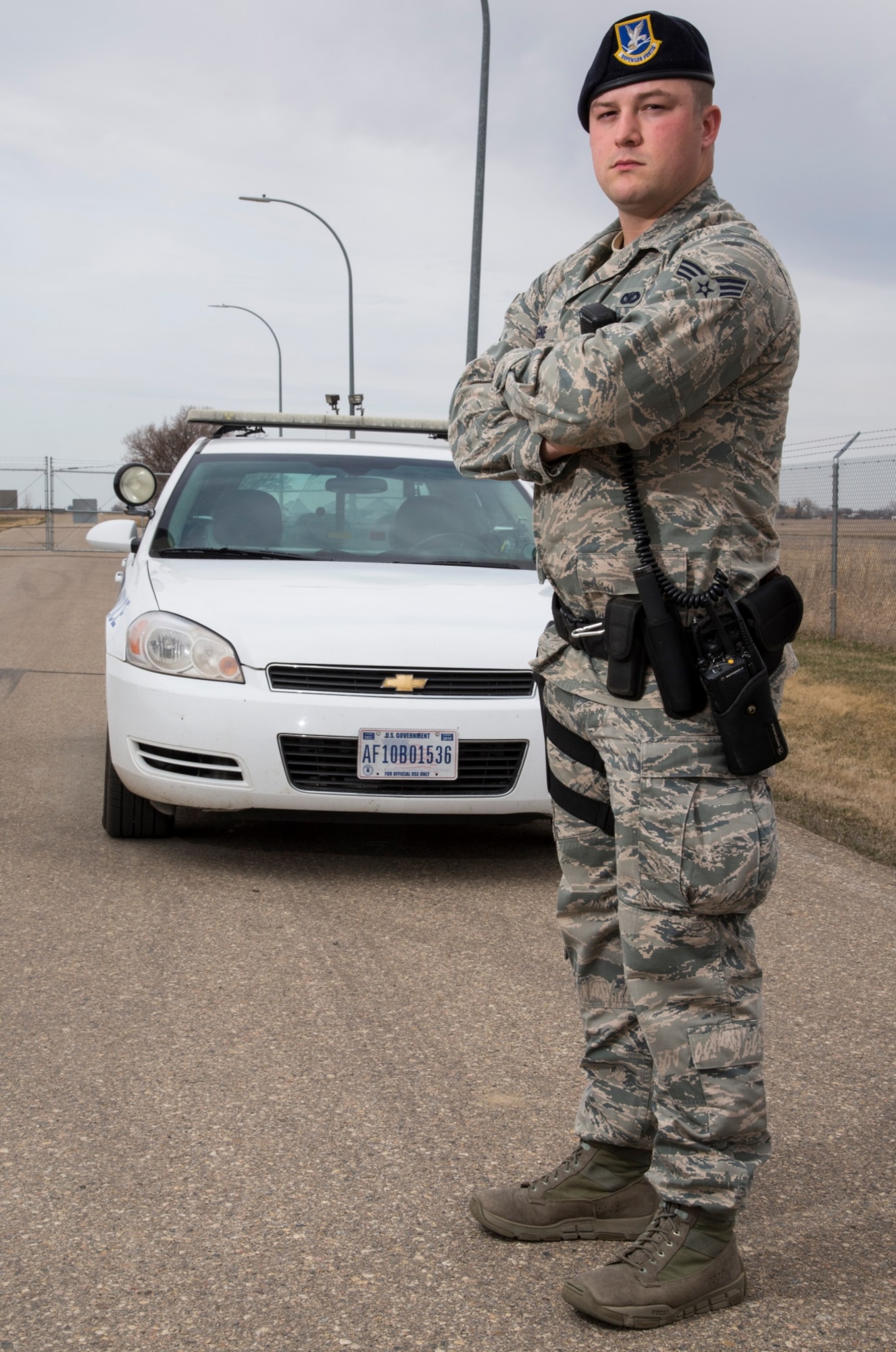 Senior Airman Eric Gagne, 5th Security Forces Squadron law enforcement patrolman, poses in front of his patrol vehicle at Minot Air Force Base, N.D., April 14, 2016. Gagne is one of several patrolmen who help keep Minot and its assets safe and secure. (U.S. Air Force photo/Airman 1st Class Christian Sullivan)