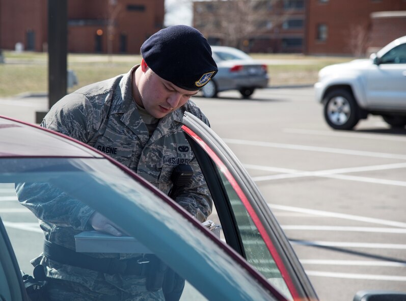 Senior Airman Eric Gagne, 5th Security Forces Squadron law enforcement patrolman, talks to a driver that he pulled over for a traffic violation at Minot Air Force Base, N.D., April 14, 2016. Watching for traffic violations is one of many tasks Gagne faces on his daily patrol. (U.S. Air Force photo/Airman 1st Class Christian Sullivan)