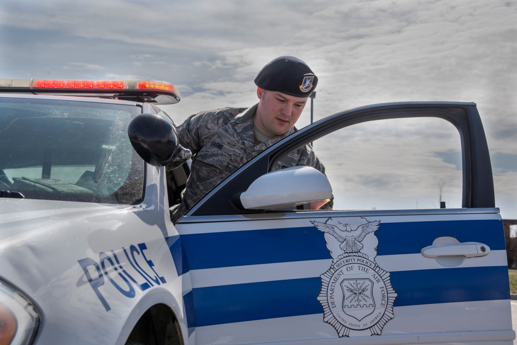 Senior Airman Eric Gagne, 5th Security Forces Squadron law enforcement patrolman, returns to his patrol car after a traffic stop at Minot Air Force Base, N.D., April 14, 2016. Watching for traffic violations is one of many tasks Gagne faces on his daily patrol. (U.S. Air Force photo/Airman 1st Class Christian Sullivan)