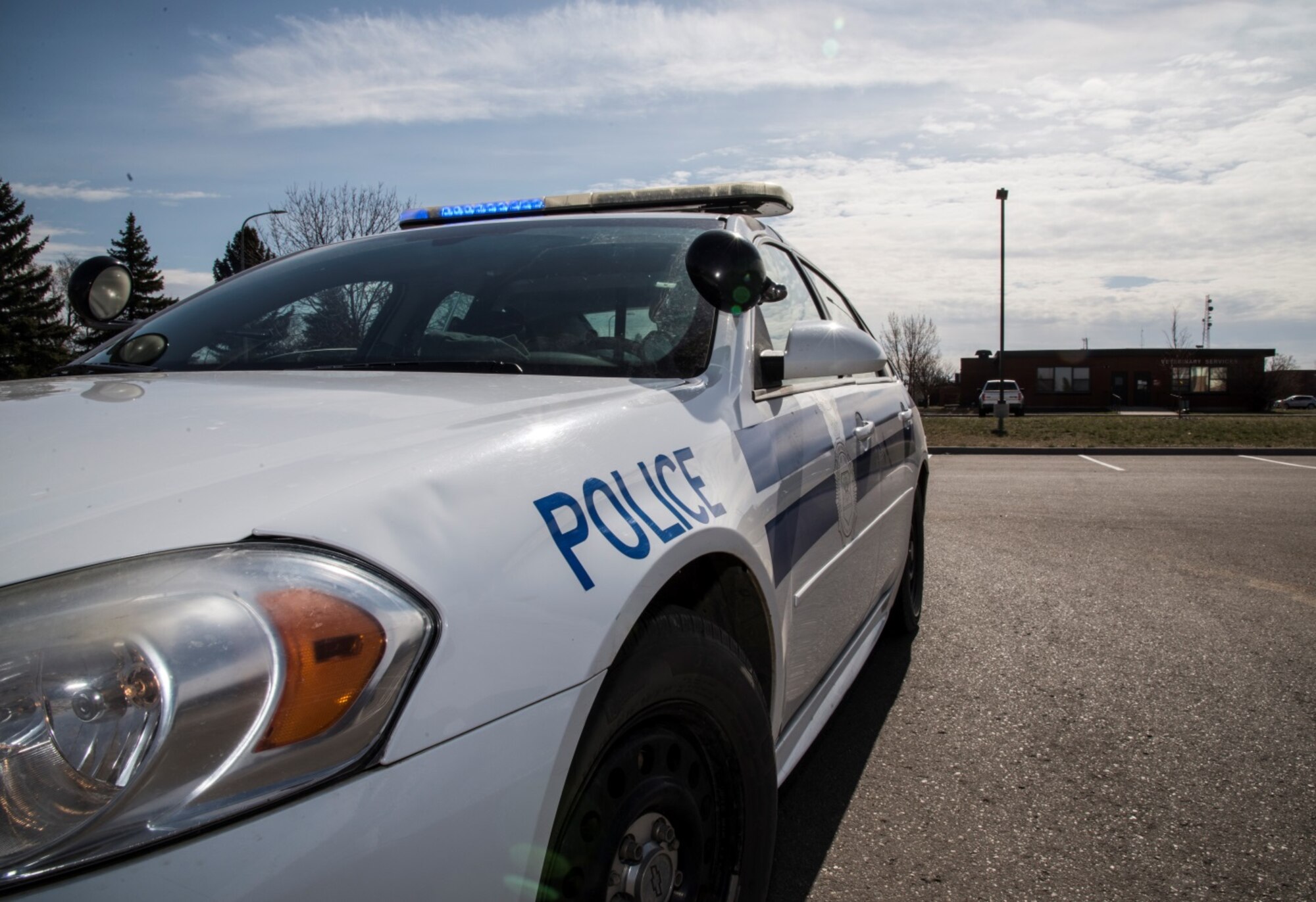 Senior Airman Eric Gagne, 5th Security Forces Squadron law enforcement patrolman, sits in his patrol car as he writes a ticket at Minot Air Force Base, N.D., April 14, 2016. Gagne is one of several patrolmen who help keep Minot and its assets safe and secure. (U.S. Air Force photo/Airman 1st Class Christian Sullivan)