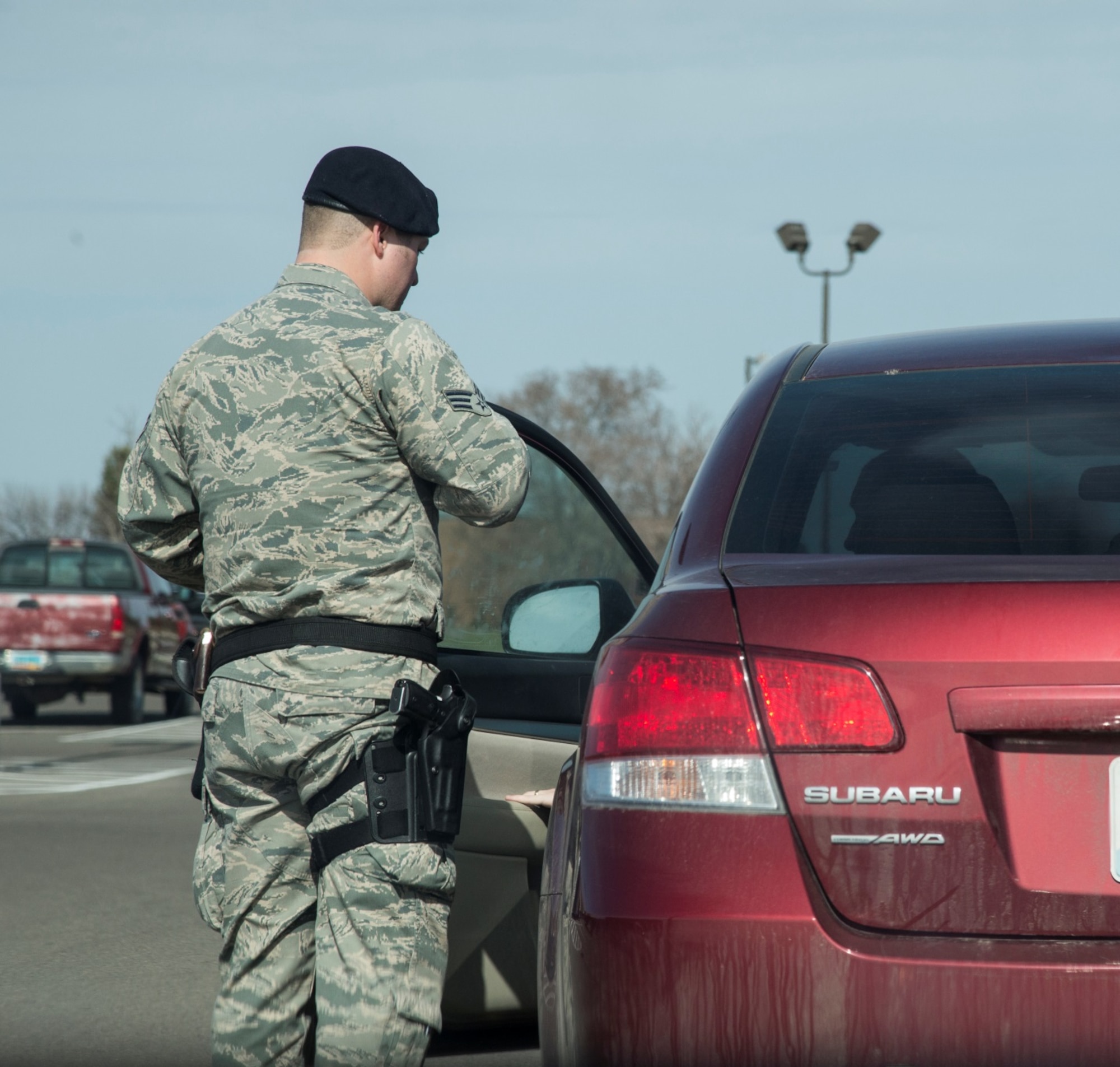 Senior Airman Eric Gagne, 5th Security Forces Squadron law enforcement patrolman, talks to a driver he pulled over for a traffic violation at Minot Air Force Base, N.D., April 14, 2016. Watching for traffic violations is one of many tasks Gagne faces on his daily patrol. (U.S. Air Force photo/Airman 1st Class Christian Sullivan)