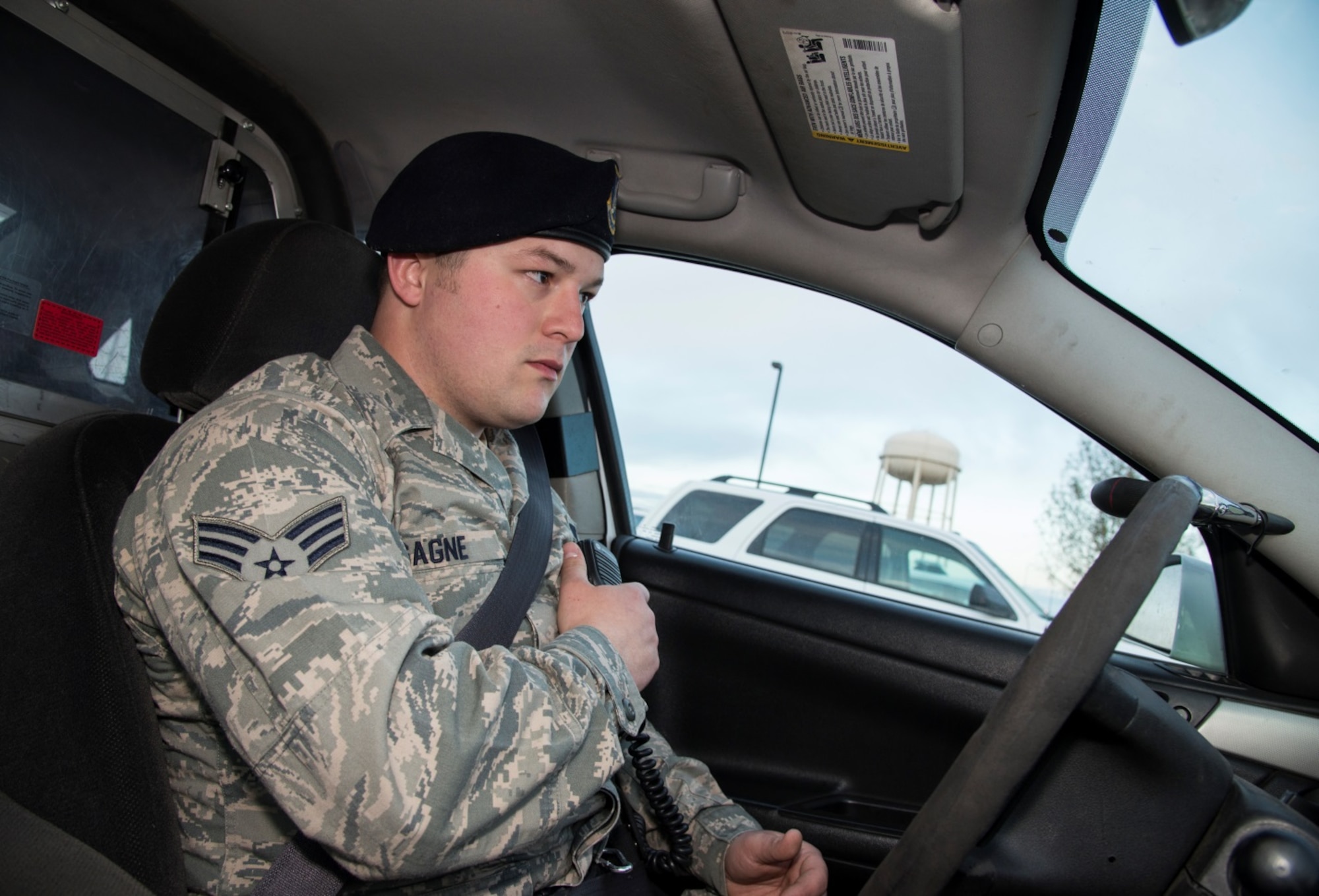Senior Airman Eric Gagne, 5th Security Forces Squadron law enforcement patrolman, notifies the law enforcement desk know that he is starting his patrol at Minot Air Force Base, N.D., April 14, 2016. Gagne is one of several patrolmen who help keep Minot and its assets safe and secure. (U.S. Air Force photo/Airman 1st Class Christian Sullivan)