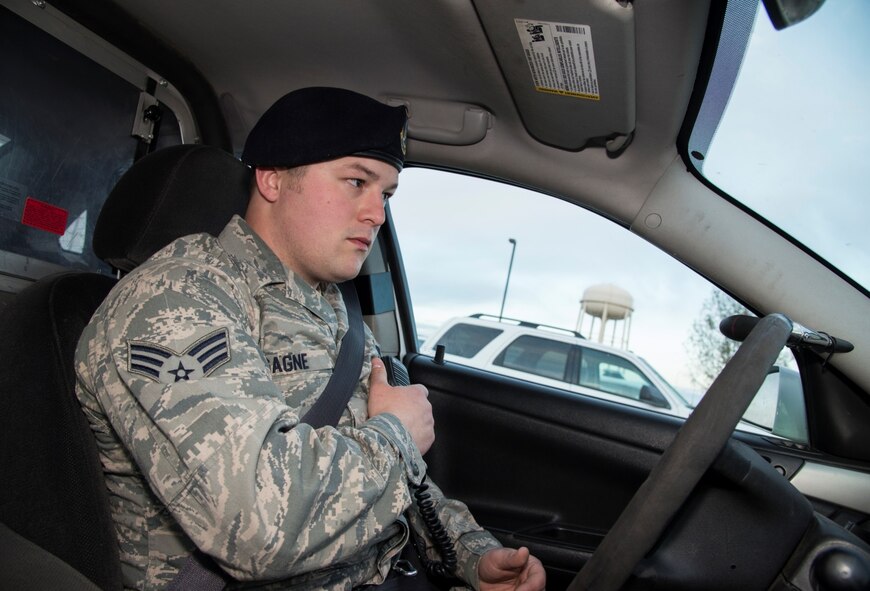 Senior Airman Eric Gagne, 5th Security Forces Squadron law enforcement patrolman, notifies the law enforcement desk know that he is starting his patrol at Minot Air Force Base, N.D., April 14, 2016. Gagne is one of several patrolmen who help keep Minot and its assets safe and secure. (U.S. Air Force photo/Airman 1st Class Christian Sullivan)
