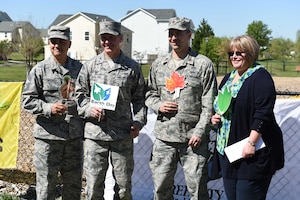 Team Andrews leadership poses for a picture after receiving the Tree City Award from the National Arbor Day Foundation at a tree planting ceremony in honor of Earth Day and Arbor Day at Joint Base Andrews, Md., April 20, 2016. JBA received its 16th award from the foundation and celebrated the 40th Anniversary of the Tree City Program. (U.S. Air Force photo by Senior Airman Joshua R. M. Dewberry/RELEASED)