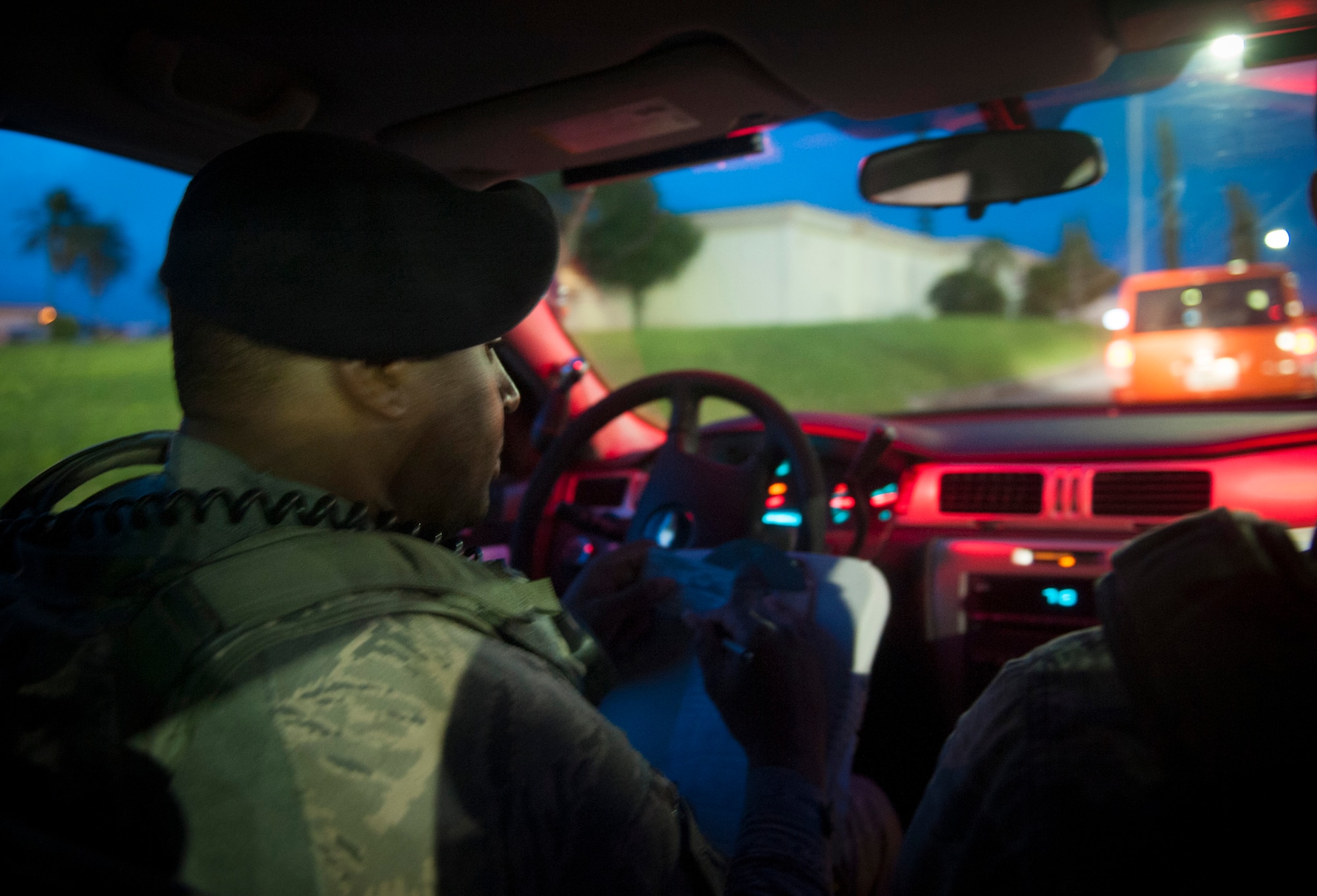 U.S. Air Force Tech. Sgt. Terrance McGee, 18th Security Forces Squadron assistant flight chief, issues a citation for speeding April 21, 2016, at Kadena Air Base, Japan. During traffic stop SFS can issue a ticket to a member violating the driving laws. (U.S. Air Force photo by Tech. Sgt. Darnell T. Cannady)
