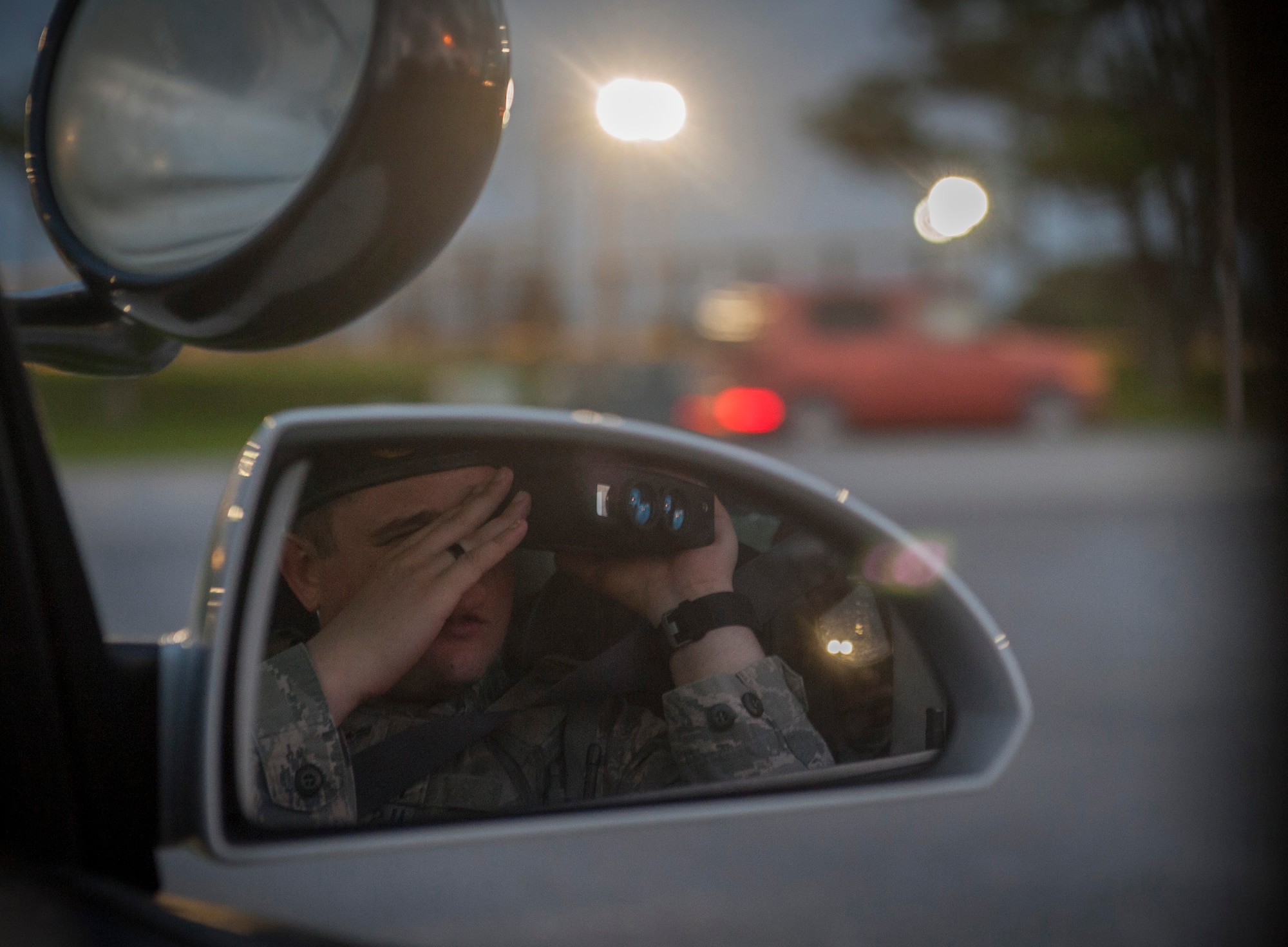 U.S. Air Force Airman 1st Class Ryan MacDonald, 18th Security Forces Squadron response force member, uses a LiDAR speed gun to check traffic speed April 21, 2016, at Kadena Air Base, Japan. Citations are issued to Kadena members who violate the speed limit or have safety violations such as a tail light being out. (U.S. Air Force photo by Tech. Sgt. Darnell T. Cannady)