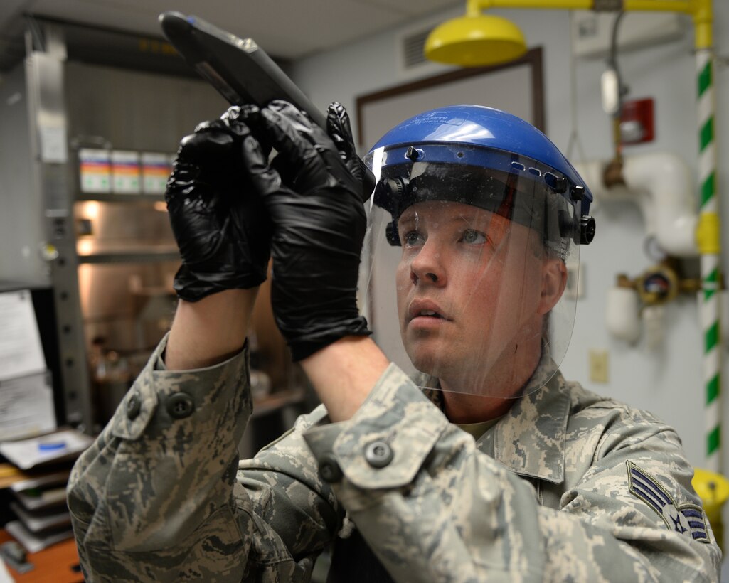 U.S. Air Force Senior Airman Timothy D. Burrows, 157th Logistics Readiness Squadron fuels lab technician uses a refractometer to measure the amount of water in jet aircraft fuel, Pease Air National Guard Base, N.H., April 21, 2016. Burrows is assigned to the POL (petroleum, oil, lubrication) section of the 157 LRS. (U.S. Air National Guard photo by Staff Sgt. Curtis J. Lenz) 
