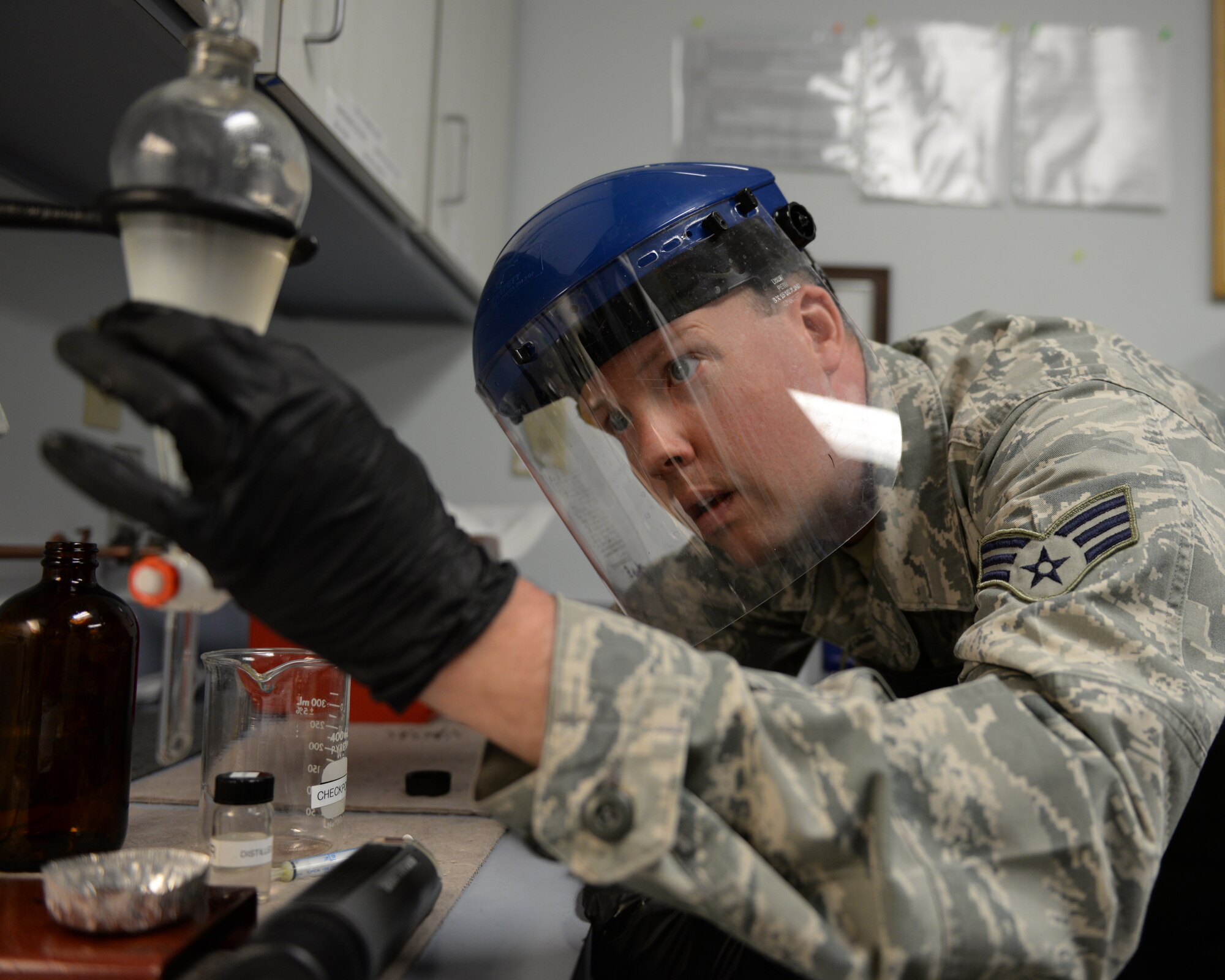 U.S. Air Force Senior Airman Timothy D. Burrows, 157th Logistics Readiness Squadron fuels lab technician performs a quality control test on jet aircraft fuel, Pease Air National Guard Base, N.H., April 21, 2016.  Burrows is assigned to the POL (petroleum, oil, lubrication) section of the 157 LRS. (U.S. Air National Guard photo by Staff Sgt. Curtis J. Lenz) 
