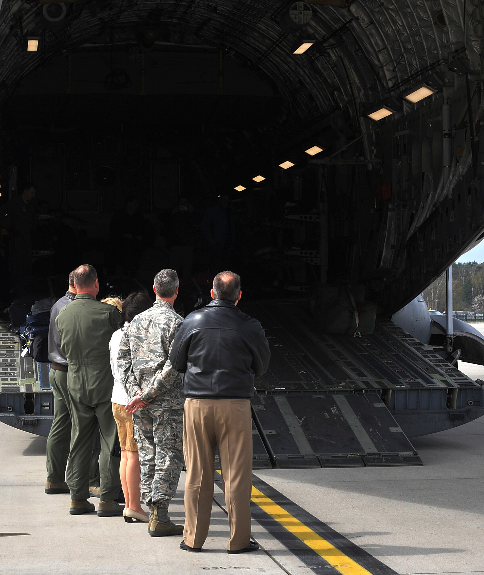 Ramstein leaders wait to greet passengers arriving here April 17, 2016, at Ramstein Air Base, Germany. Military members, civilians and civic leaders landed here and will have to opportunity to tour Ramstein to see how Airmen impact the Air Force mission. (U.S. Air Force photo/Senior Airman Larissa Greatwood)