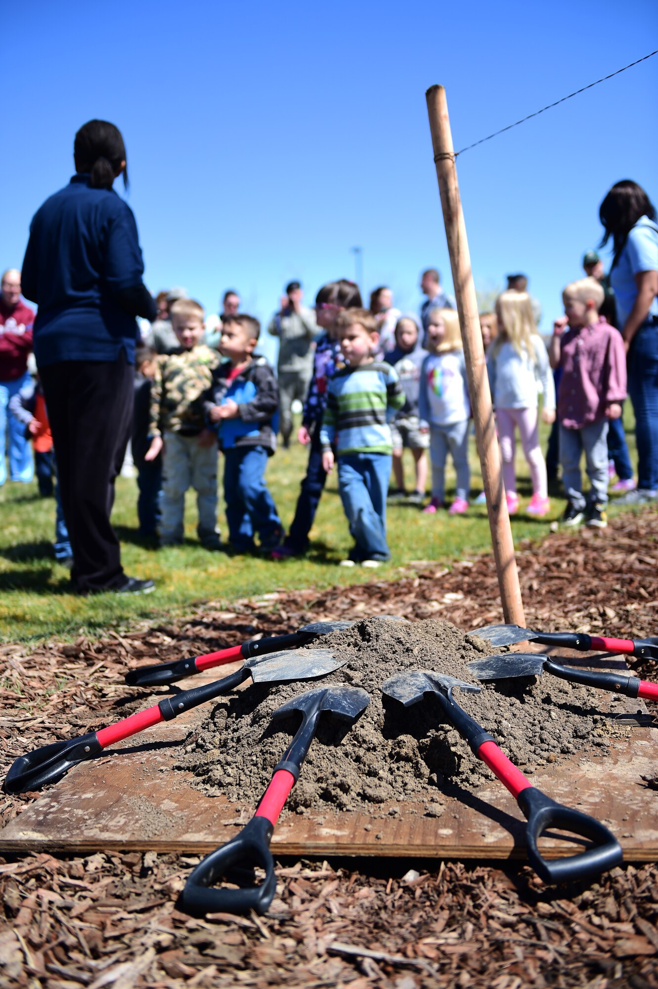 Children from A-Basin Child Development Center line up prior to getting shovels during an Earth and Arbor Day celebration April 21, 2016, on Buckley Air Force Base, Colo. Earth Day had reached into its current status as the largest secular observance in the world, celebrated by more than a billion people every year, and a day of action that changes human behavior and provokes policy changes. (U.S. Air Force photo by Senior Airman Racheal E. Watson/Released)