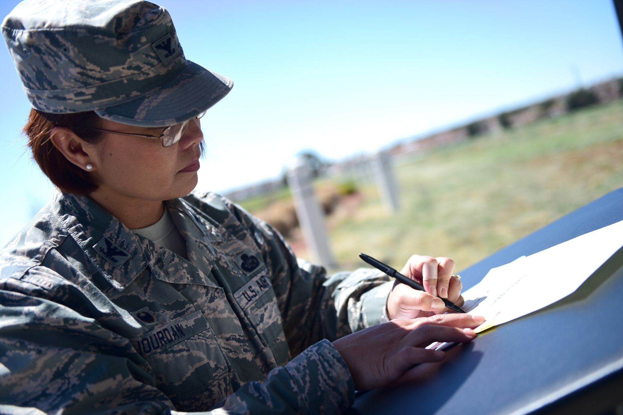 Col. Rose Jourdan, 460th Mission Support Group commander, signs an annual proclamation during an Earth and Arbor Day celebration April 21, 2016, on Buckley Air Force Base, Colo. In 1970, President Richard Nixon proclaimed the last Friday in April as National Arbor Day. (U.S. Air Force photo by Senior Airman Racheal E. Watson/Released)