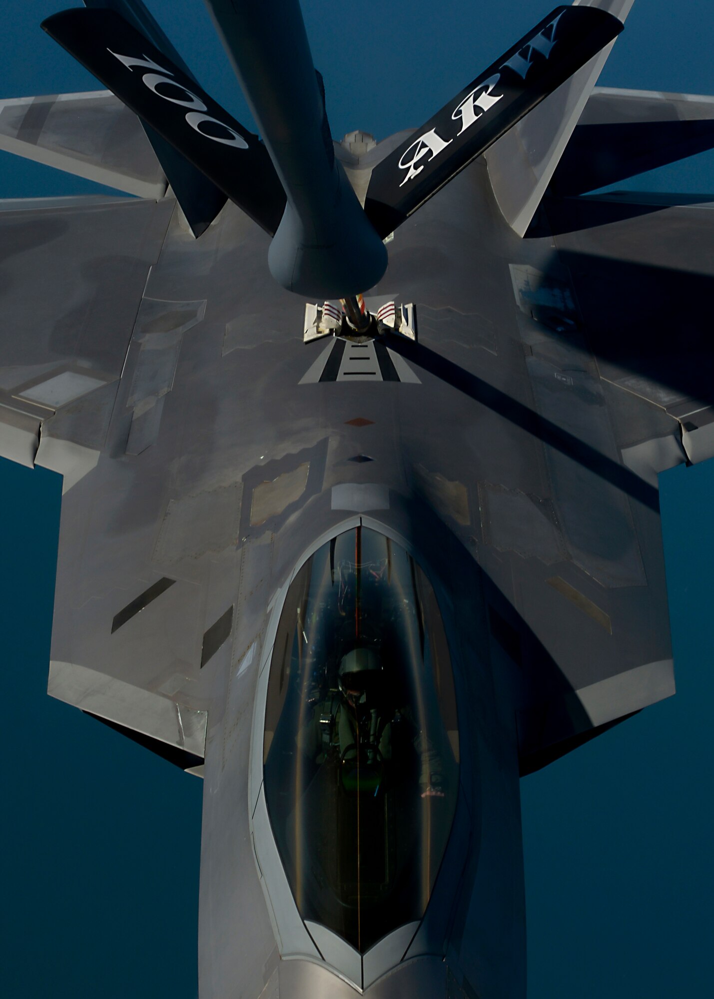 A U.S. Air Force KC-135 Stratotanker assigned to RAF Mildenhall, England, refuels an F-22 Raptor from the 95th Fighter Squadron at Tyndall Air Force Base, Fla., while participating in exercise Iron Hand April 19, 2016, over the Norfolk Sea. The F-22s conducted multiple air training exercises with 48th Fighter Wing F-15s assigned to RAF Lakenheath, as well as other U.S. and Royal Air Force aircraft throughout the exercise. (U.S. Air Force photo by Senior Airman Victoria H. Taylor/Released)