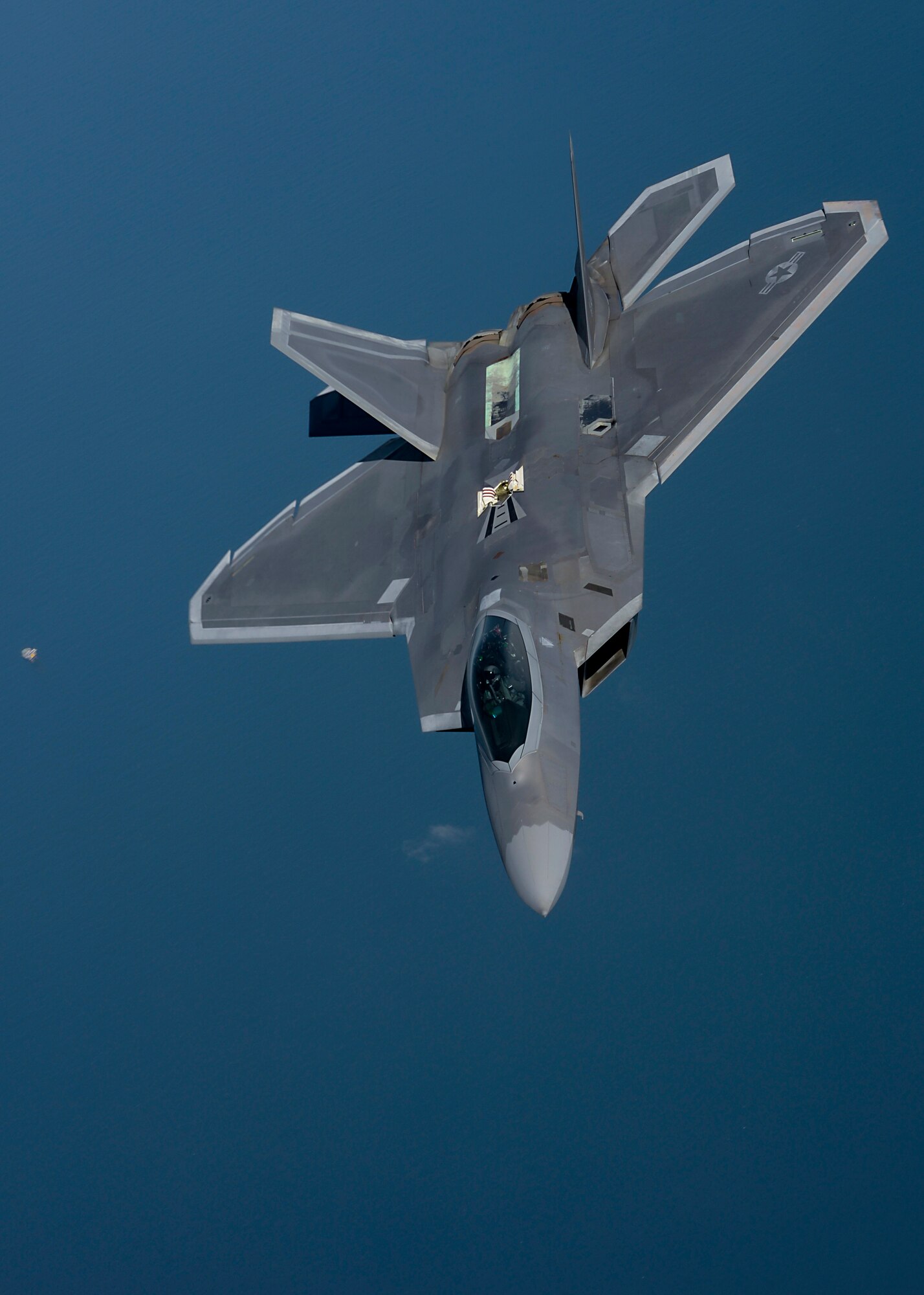 An F-22 Raptor assigned to the 95th Fighter Squadron at Tyndall Air Force Base, Fla., flies over the Norfolk Sea April 19, 2016, while participating in Exercise Iron Hand. The fifth generation, multi-role fighter aircraft participated to maximize training opportunities, affirm enduring commitments to NATO allies, and deter any actions that destabilize regional security. (U.S. Air Force photo by Senior Airman Victoria H. Taylor/Released)