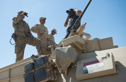 A U.S. soldier observes Iraqi soldiers during a live-fire exercise at Besmaya Range Complex in Iraq, April 21, 2016. Marine Corps Gen. Joe Dunford, chairman of the Joint Chiefs of Staff, met with Iraqi leaders and coalition trainers at the range. DoD photo by Navy Petty Officer 2nd Class Dominique A. Pineiro