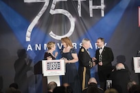Ellyn Dunford; wife of U.S. Marine Gen. Joseph F. Dunford Jr., chairman of the Joint Chiefs of Staff, and Gen. Frank J. Grass, Chief of the National Guard Bureau, present Melissa and Sgt. 1st Class Jon Meadows with the USO Metropolitan Washington-Baltimore's Colonel John Gioia Patriot Award during the USO Metropolitan Washington-Baltimore annual awards dinner, in Arlington, Va., April 19, 2016. During the event, which highlighted their 75th anniversary, the USO honored the service and sacrifice of the U.S. Armed Forces and featured a tribute to special operations forces.  DoD photo by Army Staff Sgt. Sean K. Harp