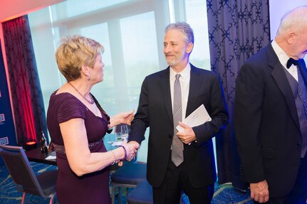 Ellyn Dunford, wife of Marine Gen. Joseph F. Dunford, chairman of the Joint Chiefs of Staff, meets former Daily Show host Jon Stewart during the USO Metropolitan Washington-Baltimore annual awards dinner, in Arlington, Va., April 19, 2016.  DoD photo by Army Staff Sgt. Sean K. Harp