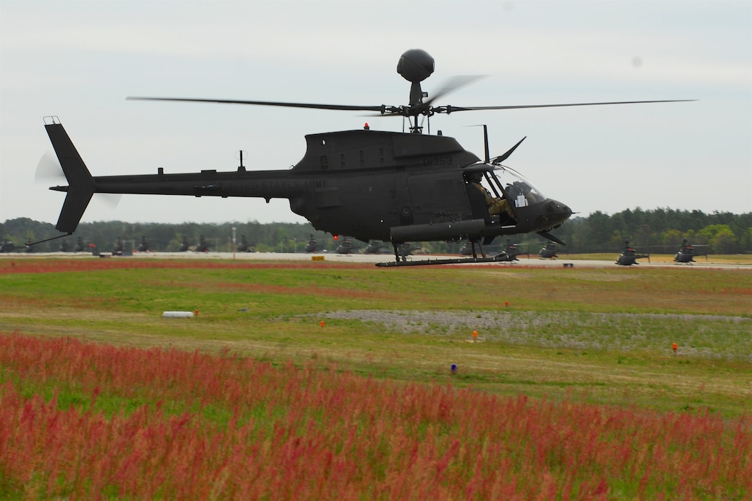 An OH-58 Kiowa Warrior helicopter prepares to depart Simmons Army Airfield, N.C., to participate in a final flyover "salute" formation over Fort Bragg, N.C., April 15, 2016. Army photo by Sgt. Neil A. Stanfield