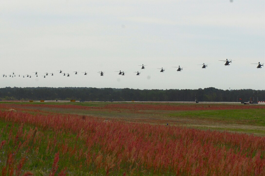 OH-58 Kiowa Warrior helicopters depart Simmons Army Airfield, N.C., to participate in a final flyover "salute" formation over Fort Bragg, N.C., April 15, 2016. Army photo by Sgt. Neil A. Stanfield