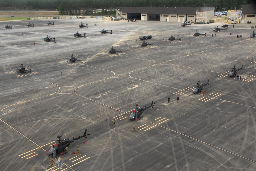OH-58 Kiowa Warrior helicopters prepare to participate in a final flyover "salute" formation at Simmons Army Airfield, N.C. April 15, 2016. Army photo by Sgt. Neil A. Stanfield