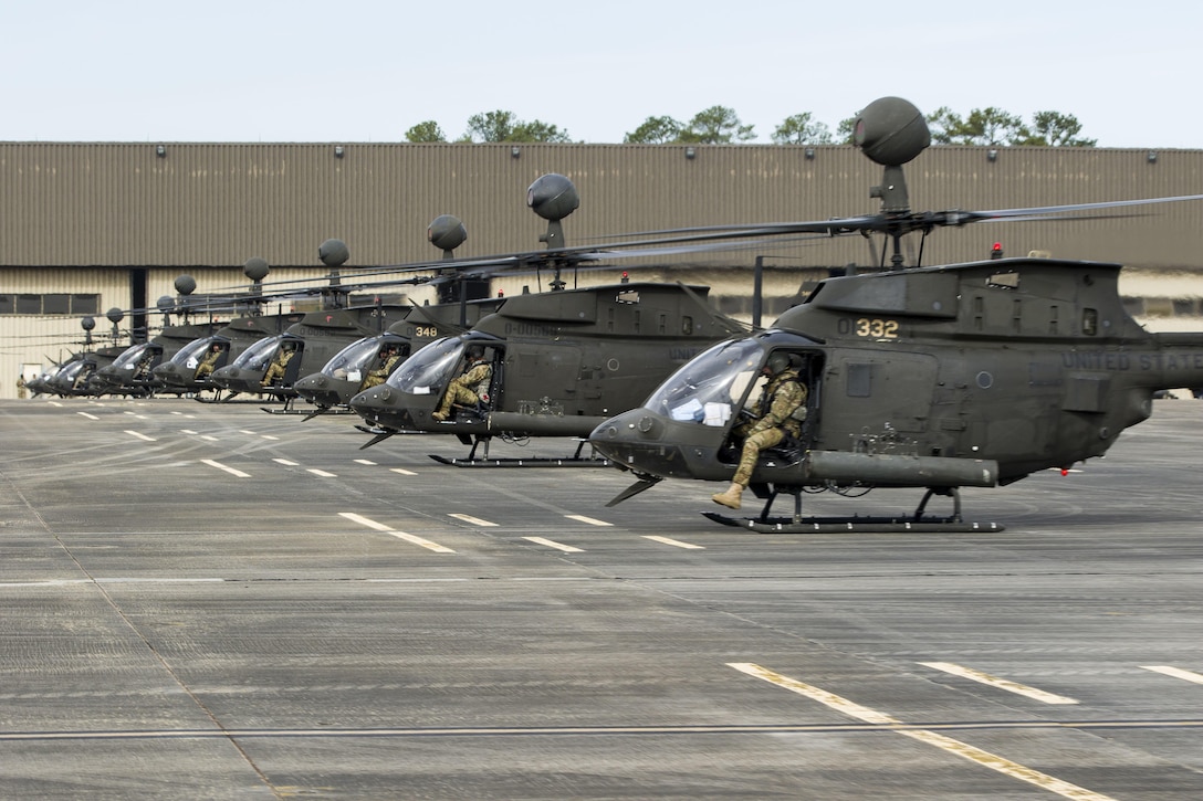OH-58 Kiowa Warrior helicopters prepare to participate in a final flyover "salute" formation at Simmons Army Airfield, N.C. April 15, 2016. Army photo by Sgt. Daniel Schroeder