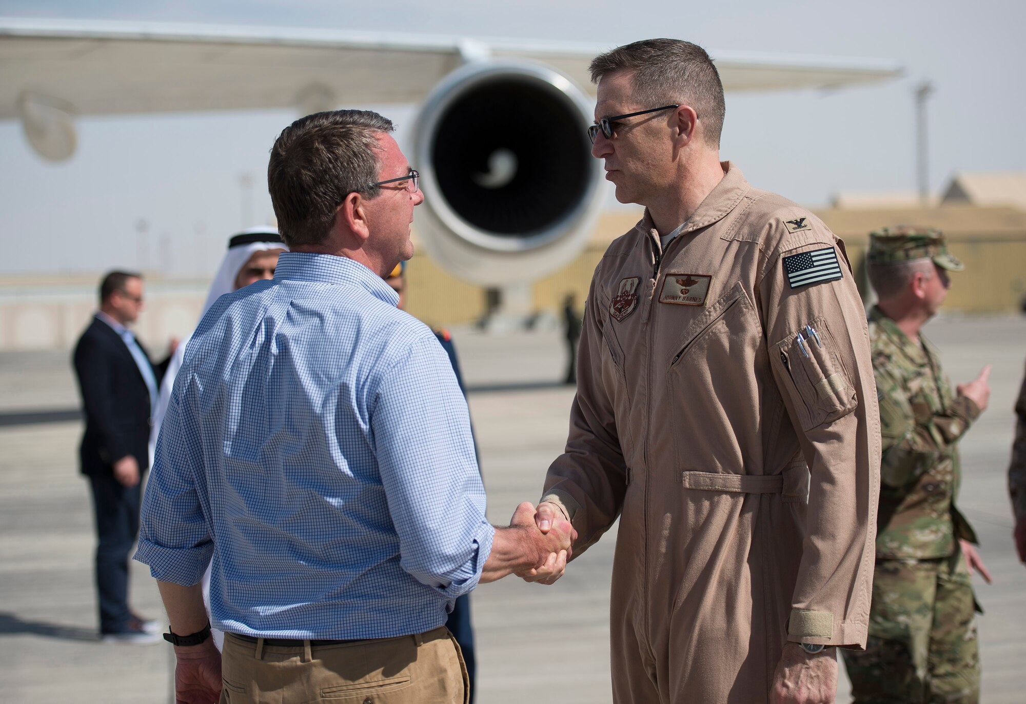 U.S. Air Force Col. Johnny Barnes, 380th Air Expeditionary Wing vice commander, greets U.S. Secretary of Defense Ash Carter at an undisclosed location in Southwest Asia, April 16, 2016. Secretary Carter visited the region to speak with service members about their role in accelerating the lasting defeat of ISIL. (U.S. Air Force photo by Staff Sgt. Chad Warren)