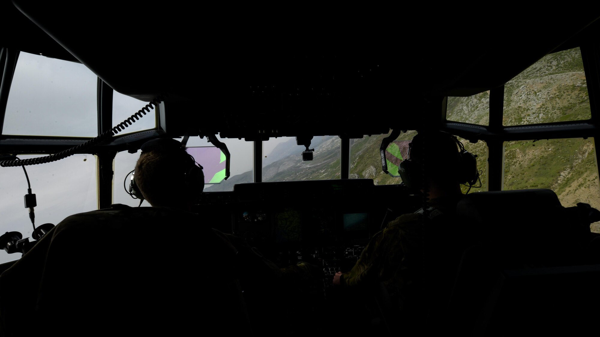 U.S. Air Force pilots aboard an MC-130J Commando II assigned to the 67th Special Operations Squadron conducted low-level operations during an exercise April 13, 2016, over Albania. The aircraft was one of two MC-130Js that conducted unilateral formation low-level operations as a part of a multi-operation training deployment. (U.S. Air Force photo by Senior Airman Victoria H. Taylor/Released)
