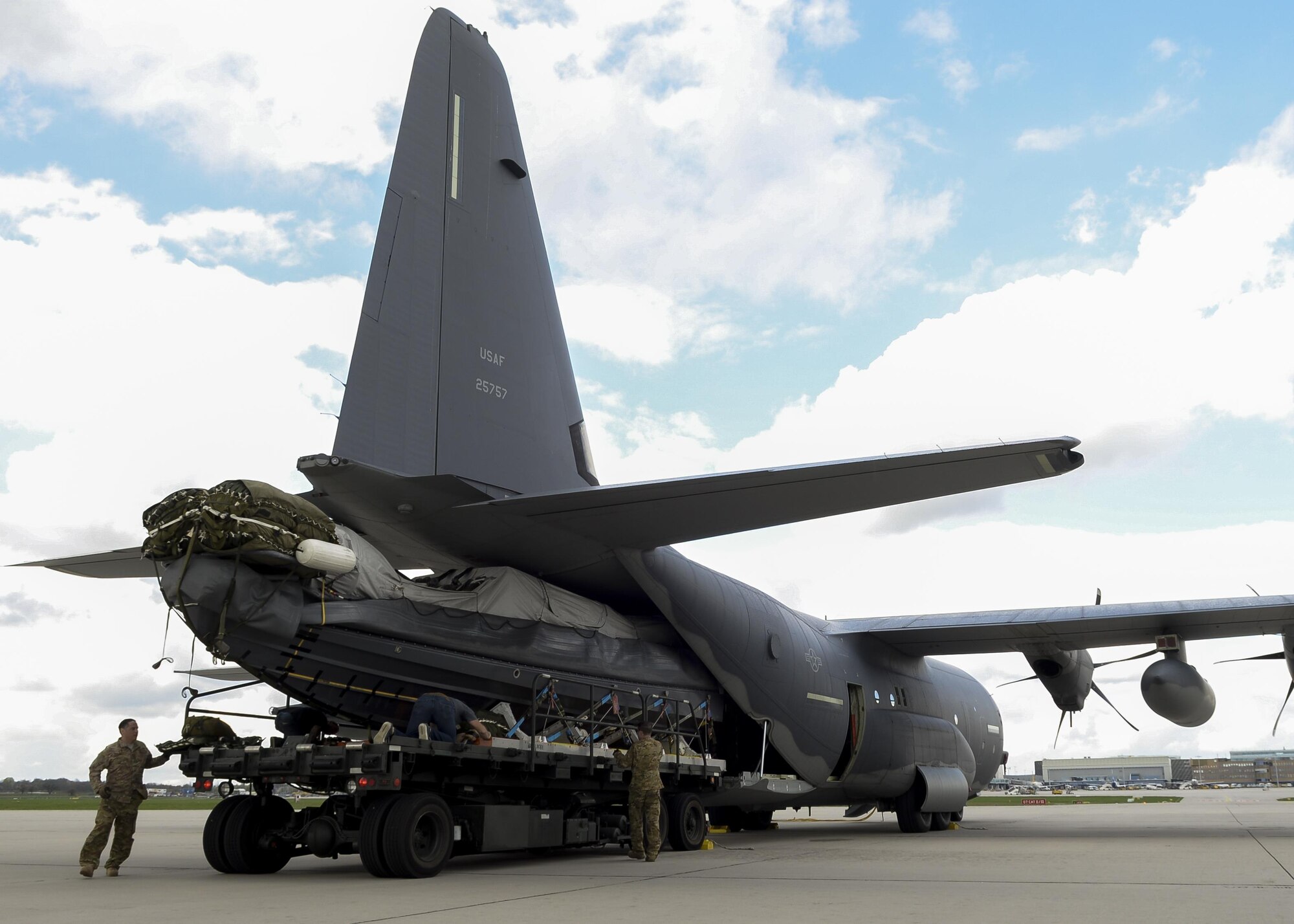 A Rigid Inflatable Boat is loaded into an MC-130J Commando II assigned to the 67th Special Operations Squadron during an exercise April 14, 2016, at Stuttgart Air Base, Germany. The preparations were made in order to conduct an airdrop mission with a U.S. Navy Maritime Craft Aerial Delivery System. (U.S. Air Force photo by Senior Airman Victoria H. Taylor/Released)