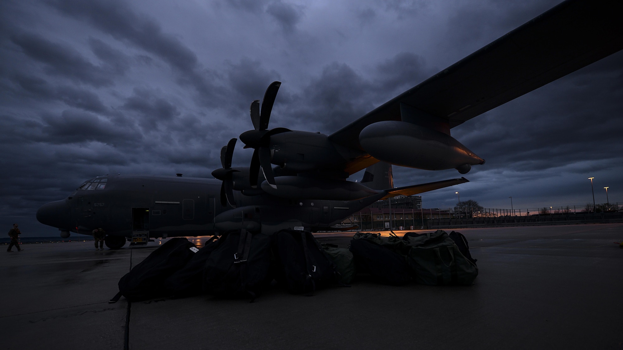 The parachutes of a U.S. Navy Special Warfare unit sit beside a U.S. Air Force MC-130J Commando II before being loaded during an exercise April 16, 2016, at Stuttgart Air Base, Germany. Airmen from RAF Mildenhall, England, worked with the Naval unit to deploy the boat off the coast of Bulgaria while merging the capabilities of the U.S. Air Force and the U.S. Navy. (U.S. Air Force photo by Senior Airman Victoria H. Taylor/Released)