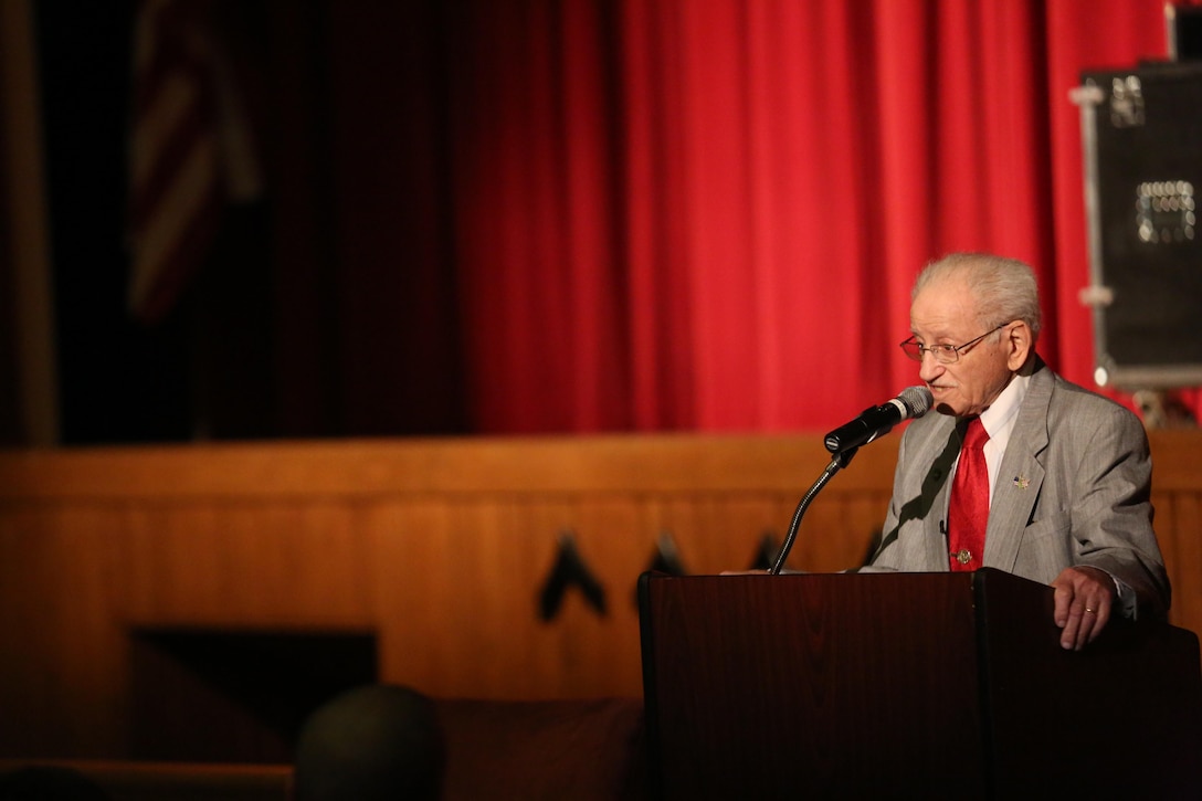 Abram Piasek, a Holocaust survivor shares his story of prison camps surviving through cruel and harsh conditions in the base theater on Marine Corps Base Camp Lejeune, April 14. The Naval Hospital Diversity Committee hosted the event to pay respects and remember the many victims of the Holocaust.