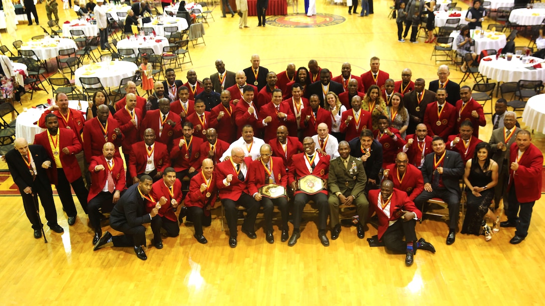 The All-Marine boxing Hall of Fame class of 2016 celebrates their inductions as the first class of inductees to be recognized for the honor at Goettge Field House on Marine Corps Base Camp Lejeune, April 16. Nearly 50 former Marine boxers, coaches and support personnel (including another 25 who were added posthumously) made history as they round out the first class of its kind.