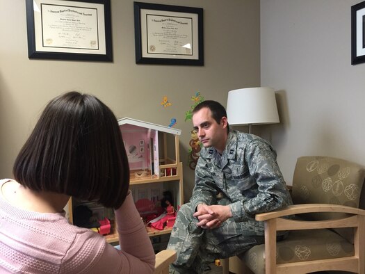Dr. Matthew Baker, a psychiatrist assigned to the 88th Medical Operations Squadron, Wright-Patterson Air Force Base, Ohio, consults with a client. (U.S. Air Force courtesy photo)

