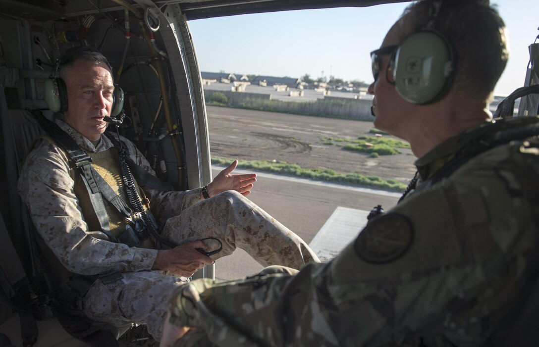 Marine Corps Gen. Joe Dunford, chairman of the Joint Chiefs of Staff, left, speaks to Army Lt. Gen. Sean McFarland, commander, Combined Joint Task Force - Operation Inherent Resolve, during a helicopter transit to Baghdad, April  21, 2016. DoD photo by Navy Petty Officer 2nd Class Dominique A. Pineiro