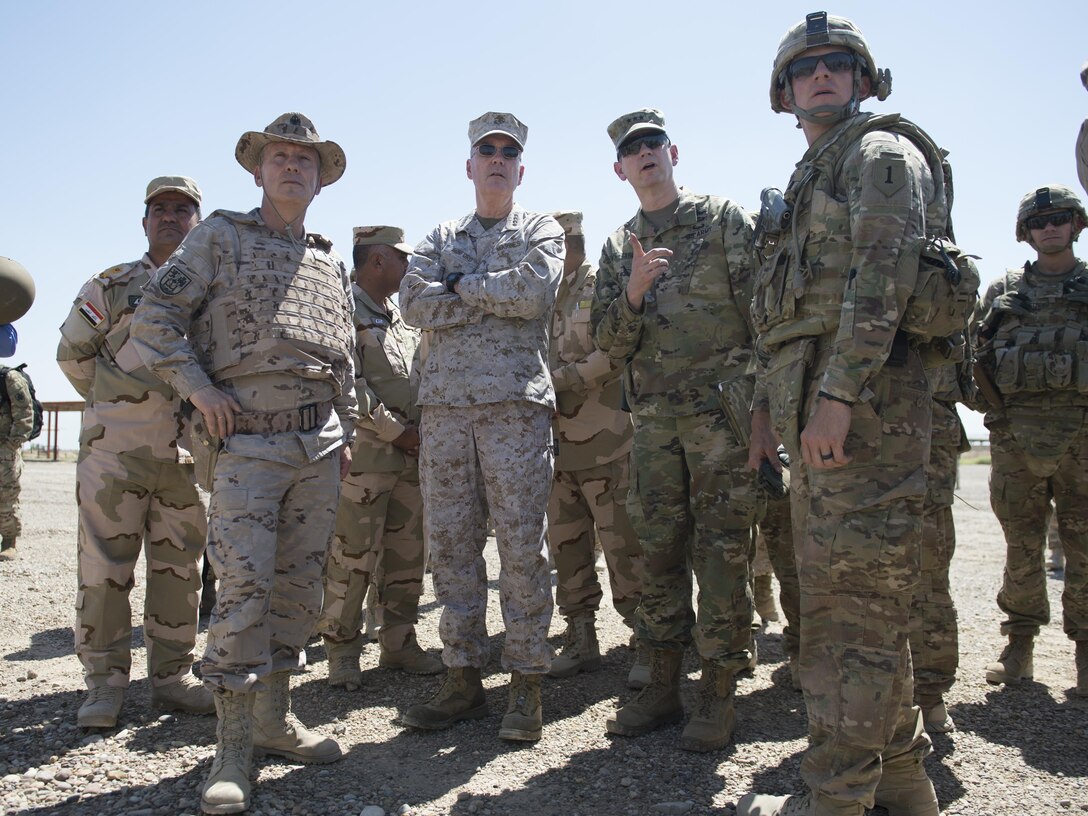 Marine Corps Gen. Joe Dunford, chairman of the Joint Chiefs of Staff, meets with trainers at Besmaya Range Complex, April  21, 2016. There are 3,782 Iraqi and peshmerga soldiers being trained at fives sites across Iraq. Trainers come from the United States, Finland, the United Kingdom, Germany, Spain, Portugal, the Netherlands, Hungary, Italy, Norway, Australia, Latvia, New Zealand, Denmark, and France. DoD photo by Navy Petty Officer 2nd Class Dominique A. Pineiro