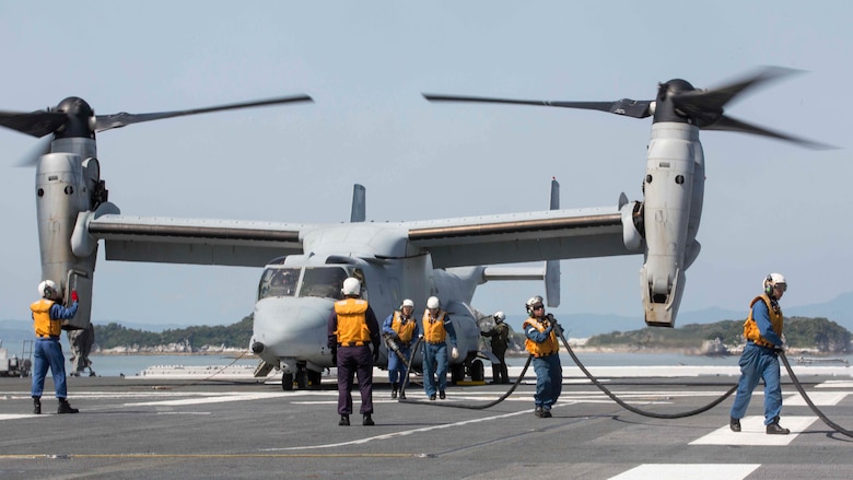 Japan Maritime Self-Defense Force personnel finish refueling a U.S. Marine Corps MV-22B Osprey tiltrotor aircraft from Marine Medium Tiltrotor Squadron (VMM) 265 (Reinforced), 31st Marine Expeditionary Unit (MEU), aboard the JS Hyuga (DDH 181), at sea, April 22, 2016. The Osprey received supplies from the Hyuga in support of the relief effort after a series of earthquakes struck the island of Kyushu. The 31st MEU is the only continually forward-deployed MEU and remains the Marine Corps' force-in-readiness in the Asia-Pacific region. 