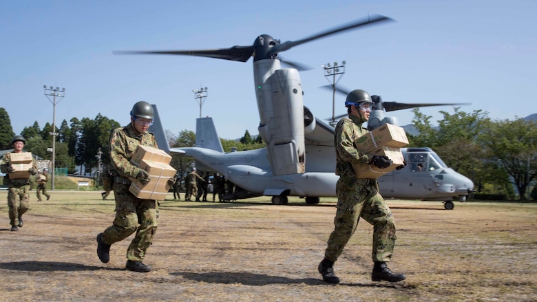 Japan Ground Self-Defense Force personnel carry supplies from a U.S. Marine Corps MV-22B Osprey tiltrotor aircraft from Marine Medium Tiltrotor Squadron (VMM) 265 (Reinforced), 31st Marine Expeditionary Unit (MEU), in Hakusui Sports Park, Kyushu island, Japan, April 22, 2016. The supplies are in support of the relief effort after a series of earthquakes struck the island of Kyushu. The 31st MEU is the only continually forward-deployed MEU and remains the Marine Corps' force-in-readiness in the Asia-Pacific region. 