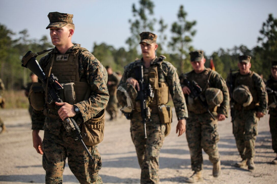 Marines with 2nd Combat Engineer Battalion conduct a hike to their new command post at Camp Lejeune, N.C., April 21, 2016. Upon reaching the command post, Maj. Gen. Brian Beaudreault, commanding general 2nd Marine Division, and Lt. Col. Gary A. McCullar, the commanding officer 2nd CEB, inaugurated the relocation by cutting barbed wire placed at the door. (U.S. Marine Corps photo by Cpl. Paul S. Martinez/Released)
