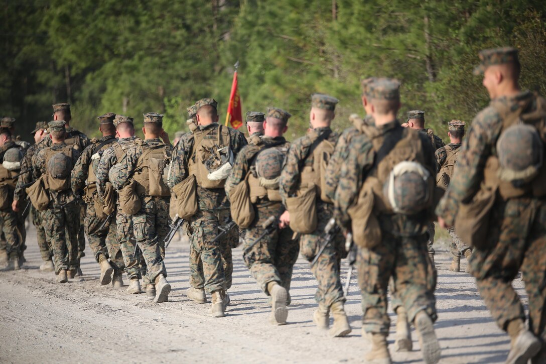 Marines with 2nd Combat Engineer Battalion conduct a hike to their new command post at Camp Lejeune, N.C., April 21, 2016. The hike, led by Maj. Gen. Brian Beaudreault, commanding general 2nd Marine Division; Lt. Col. Gary A. McCullar, the commanding officer 2nd CEB; and Sgt. Maj. Demetrius L. Hadley, the sergeant major of 2nd CEB, covered 12 miles. (U.S. Marine Corps photo by Cpl. Paul S. Martinez/Released)