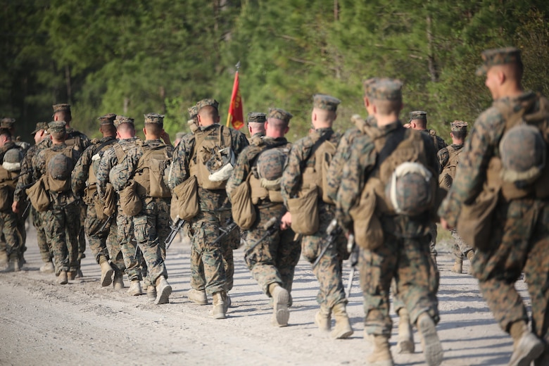 Marines with 2nd Combat Engineer Battalion conduct a hike to their new command post at Camp Lejeune, N.C., April 21, 2016. The hike, led by Maj. Gen. Brian Beaudreault, commanding general 2nd Marine Division; Lt. Col. Gary A. McCullar, the commanding officer 2nd CEB; and Sgt. Maj. Demetrius L. Hadley, the sergeant major of 2nd CEB, covered 12 miles. (U.S. Marine Corps photo by Cpl. Paul S. Martinez/Released)
