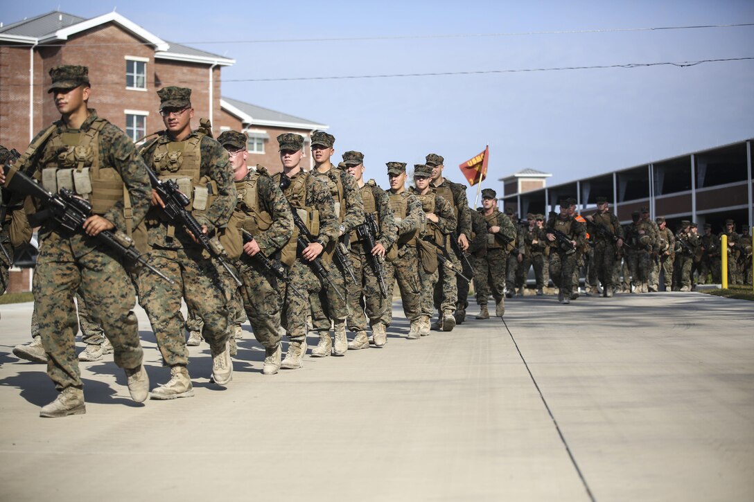 Marines with 2nd Combat Engineer Battalion conduct a hike to their new command post at Camp Lejeune, N.C., April 21, 2016. Upon reaching the command post, Maj. Gen. Brian Beaudreault, commanding general 2nd Marine Division, and Lt. Col. Gary A. McCullar, the commanding officer 2nd CEB, inaugurated the relocation by cutting barbed wire placed at the door. (U.S. Marine Corps photo by Cpl. Paul S. Martinez/Released)