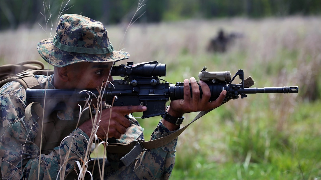 Pfc. Dugan Gilbert, a rifleman with 3rd Battalion, 2nd Marine Regiment, suppresses enemy fire during a training exercise at Marine Corps Base Camp Lejeune, N.C., April 20, 2016. The unit practiced buddy rushing and squad tactics to maintain readiness and prepare for future deployments. 