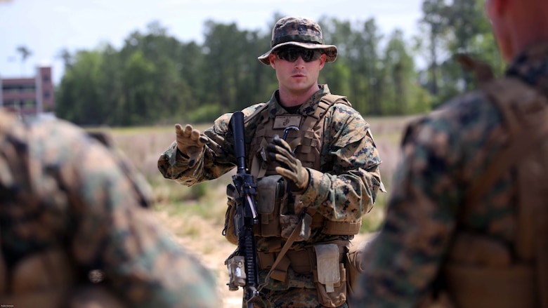 Marines with 3rd Battalion, 2nd Marine Regiment consolidate to review their performance during a training exercise at Marine Corps Base Camp Lejeune, N.C., April 20, 2016. The unit practiced buddy rushing and squad tactics to maintain readiness and prepare for future deployments. 