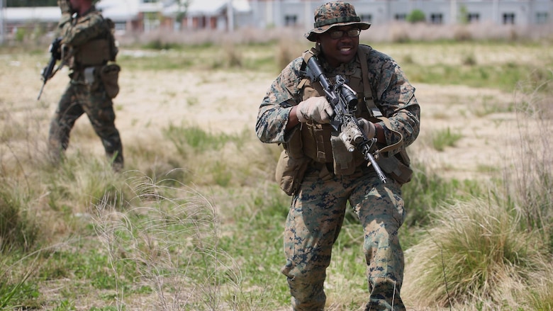 Lance Cpl. Darnell Hamm, a team leader with 3rd Battalion, 2nd Marine Regiment takes immediate action when coming in contact with the enemy during a training exercise at Marine Corps Base Camp Lejeune, N.C., April 20, 2016. The unit practiced buddy rushing and squad tactics to maintain readiness and prepare for future deployments. 