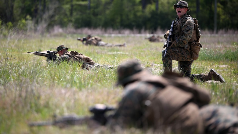 Marines with 3rd Battalion, 2nd Marine Regiment receive commands while holding their positions during a training exercise at Marine Corps Base Camp Lejeune, N.C., April 20, 2016. The unit practiced buddy rushing and squad tactics to maintain readiness and prepare for future deployments. 