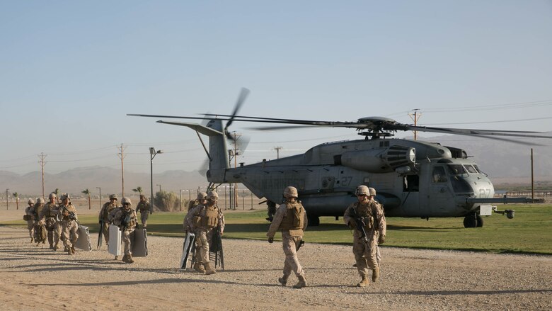 Marines with Combat Logistics Battalion 24 off load from a CH-53 ‘Super Stallion’ at Del Valle Field at Marine Corps Air Ground Combat Center Twentynine Palms, California, as part of a Non-combatant Evacuation Operation exercise in support of Weapons and Tactics Instructor Course 2-16 April 15, 2016. 