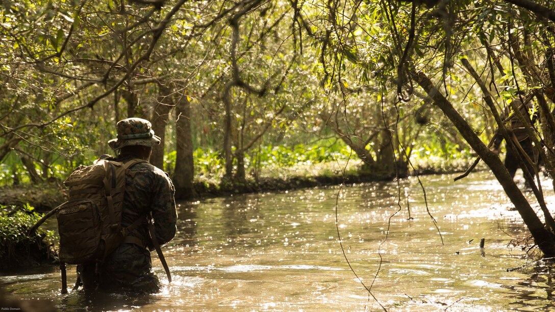 U.S. Marines with 2nd Battalion, 8th Marine Regiment divert from a trail that is known to have notional improvised explosive devices during an attack evolution at Marine Corps Base Camp Lejeune, N.C., April 20, 2016. Intelligence was gathered from an enemy guard causing the Marines to avoid the path to continue to the objective.  