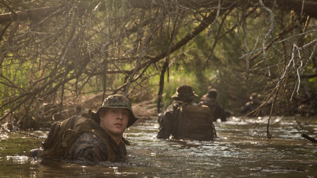 Cpl. Kody Biggs, a rifleman with 2nd Battalion, 8th Marine Regiment, makes his down river, around a trail that is known to have notional improvised explosive devices during an attack evolution at Marine Corps Base Camp Lejeune, N.C., April 20, 2016. The Marines conducted patrols, ambushes and assaults to prepare of their upcoming Integrated Training Exercise. 