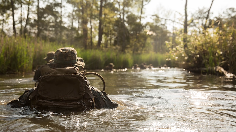 U.S. Marines with 2nd Battalion, 8th Marine Regiment divert from a trail that is known to have notional improvised explosive devices during an attack evolution at Marine Corps Base Camp Lejeune, N.C., April 20, 2016. Intelligence was gathered from an enemy guard leading the Marines to avoid the path to continue to the objective. 