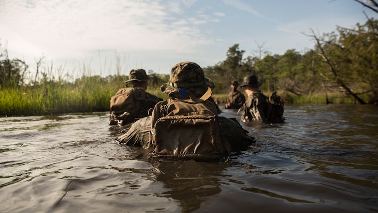 U.S. Marines with 2nd Battalion, 8th Marine Regiment swim their way around a trail that is known to have notional improvised explosive devices during an attack evolution at Marine Corps Base Camp Lejeune, N.C., April 20, 2016. Role players were placed throughout the course, adding various scenarios which included ambushing a patrol and assaulting an enemy fortified position. 
