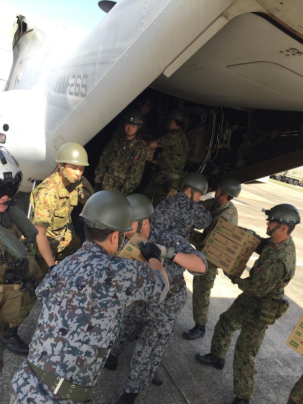 Japanese soldiers load relief supplies into a U.S. Marine Corps MV-22B Osprey aircraft at the Kumamoto airport in Japan, April 22, 2016. Marine Corps photo by Capt. Jennifer Giles