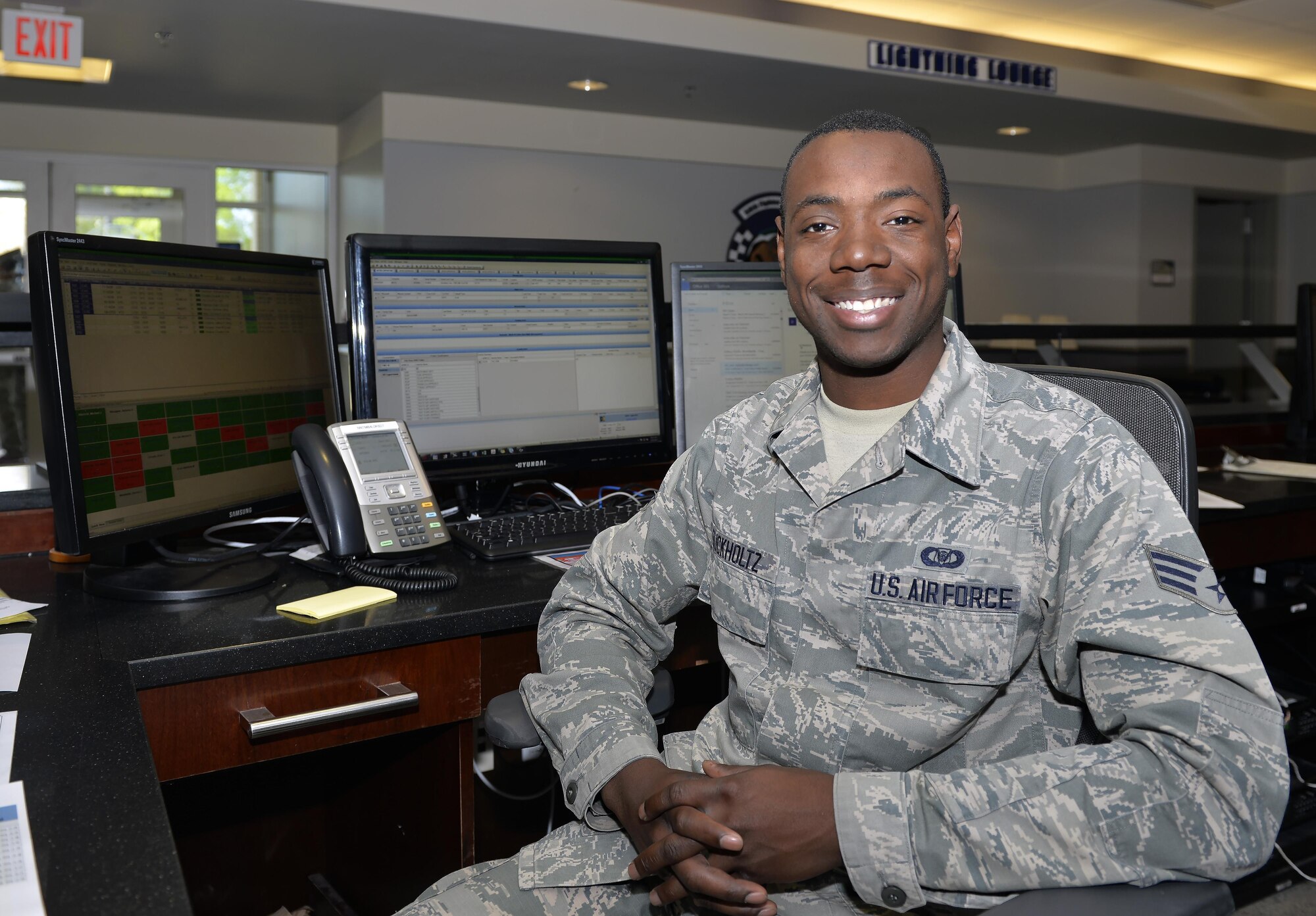 Senior Airman Markese Buckholtz, 58th FS aviation resource manager, sits at his desk at Eglin Air Force Base, Fla., March 30, 2016. Buckholtz will be attending Embry Riddle Aeronautical University in Prescott, Arizona as part of the Senior Leader Enlisted Commissioning Program. After spending a little over two years in the enlisted force, Buckholtz hopes to commission as an officer after receiving his degree and fly aircraft such as the F-35A Lightning II. (U.S. Air Force photo/Senior Airman Andrea Posey)